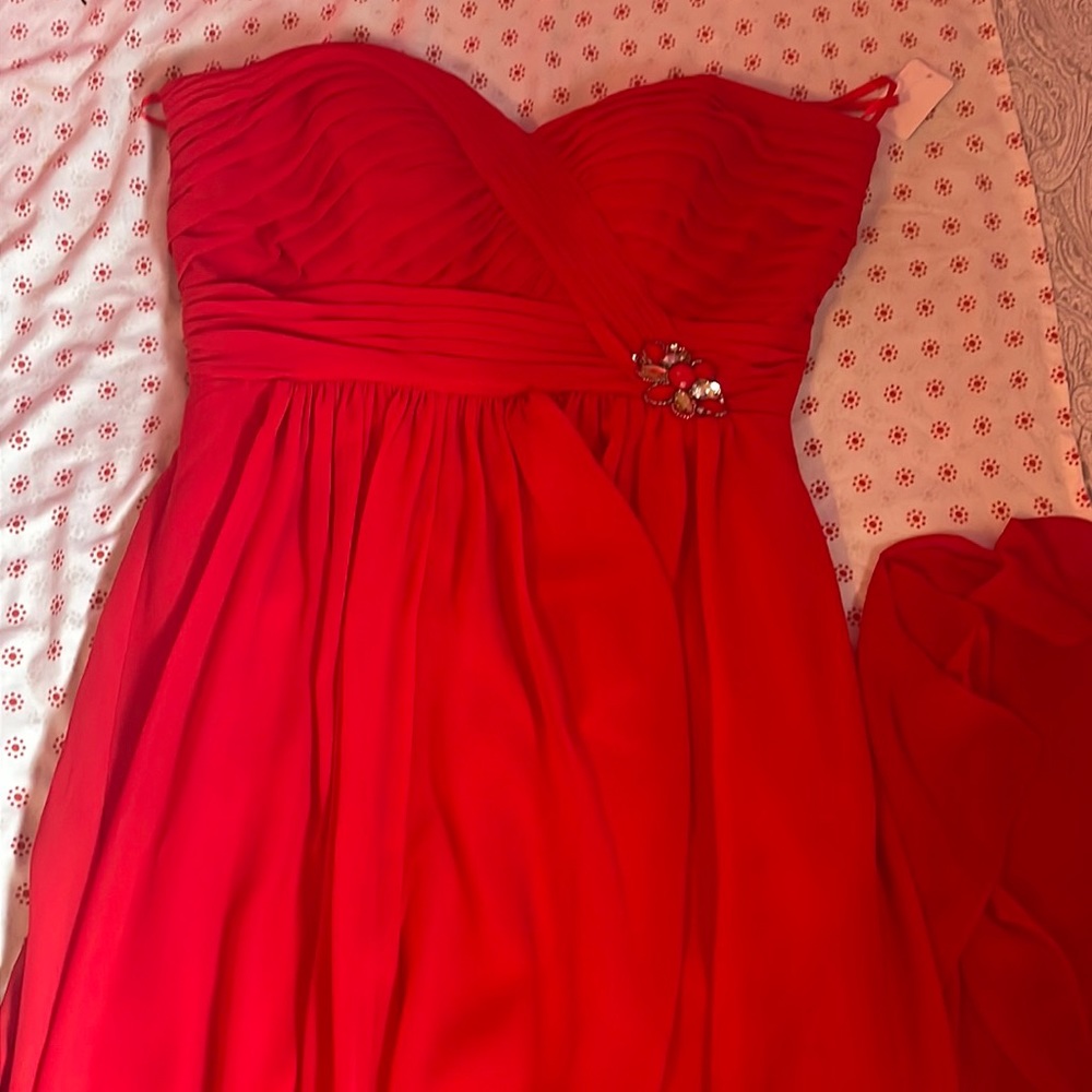 Red dress with a red scarf, earrings and necklace to match
